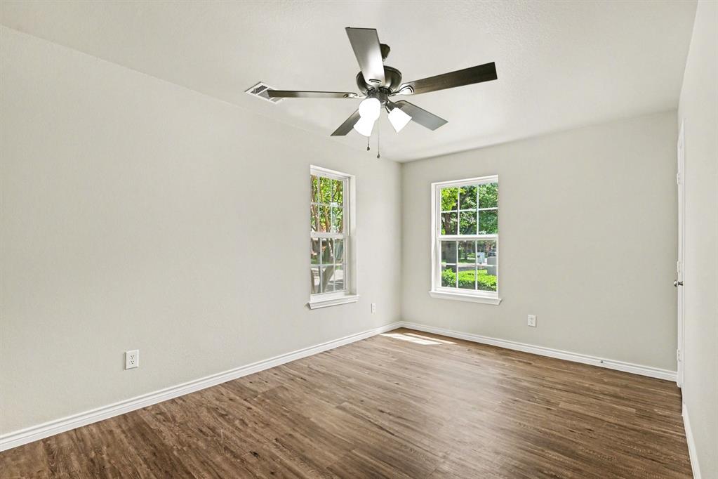 6113 Haley Lane Fort Worth, TX 76132 - Photo 23 of 38 Secondary Bedroom, new luxury vinyl plank flooring, new ceiling fan, walk-in closet.