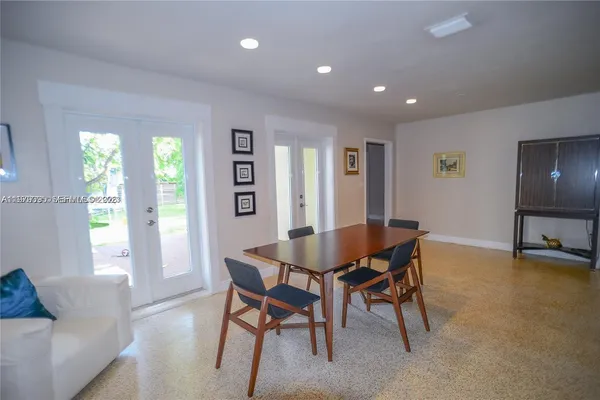 a view of a livingroom with furniture and a window