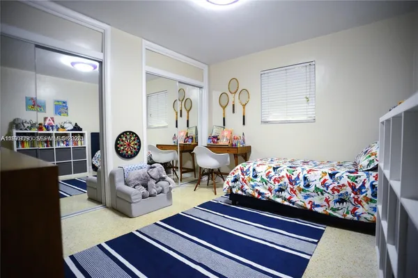 a bed room with furniture and a window