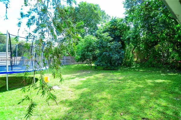 a view of a garden with a tree