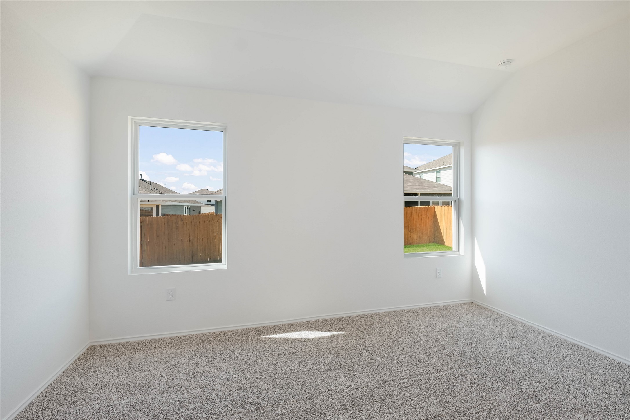 12204 Douglas Fir Circle Mustang Ridge, TX 78610 - Photo 11 of 17 an empty room with windows and closet