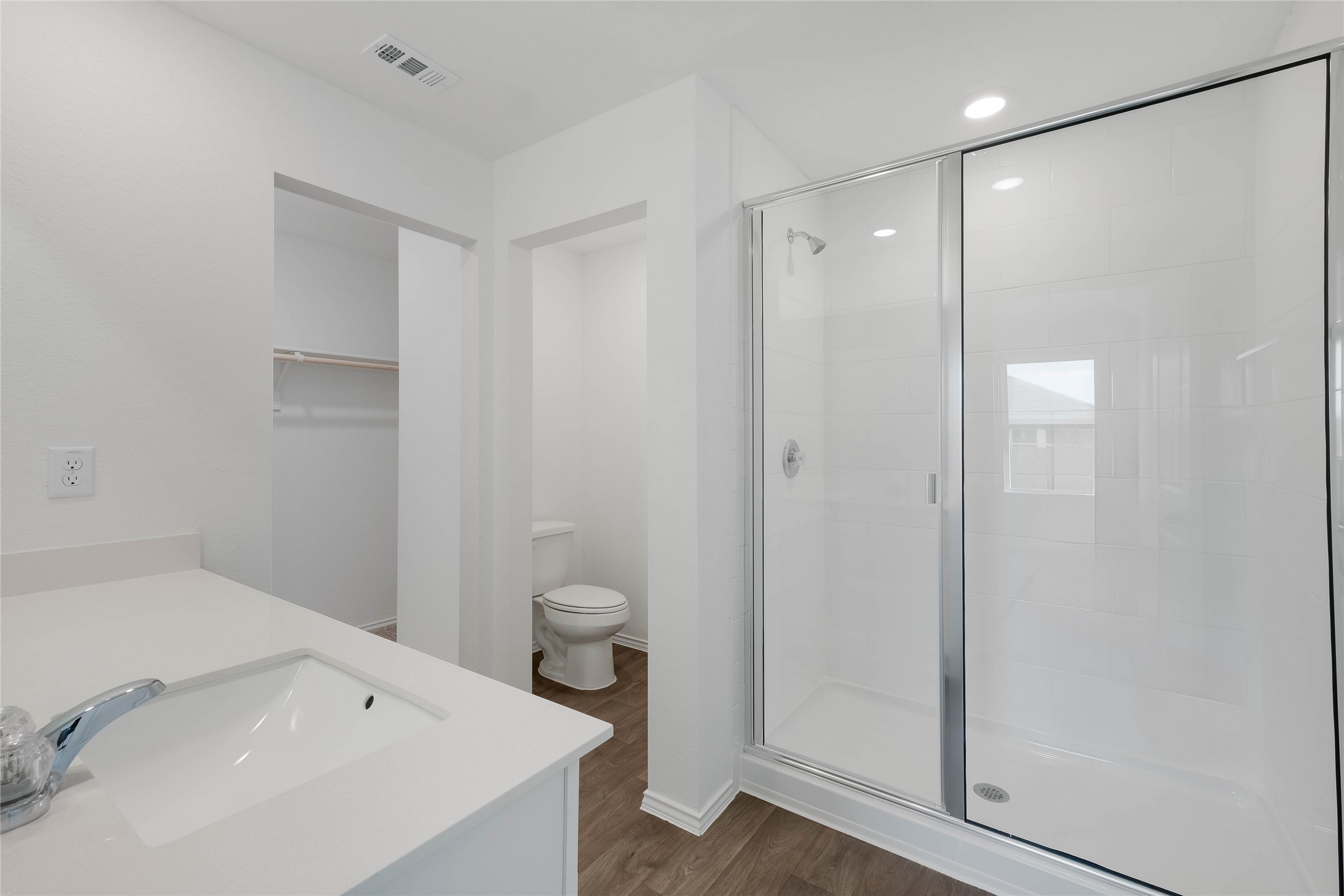 12204 Douglas Fir Circle Mustang Ridge, TX 78610 - Photo 12 of 17 a bathroom with a sink a toilet and shower