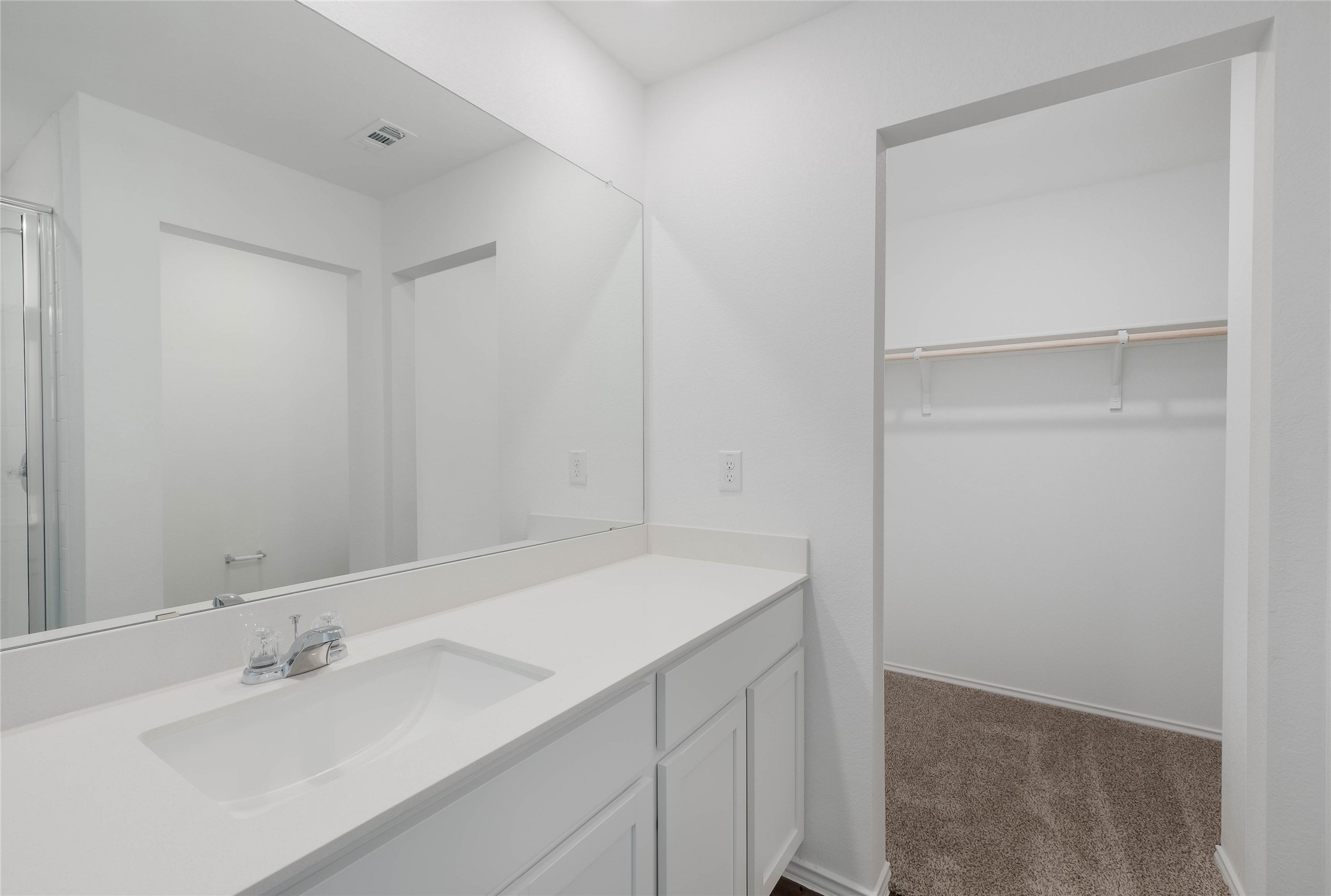 12204 Douglas Fir Circle Mustang Ridge, TX 78610 - Photo 13 of 17 a bathroom with a sink and a mirror