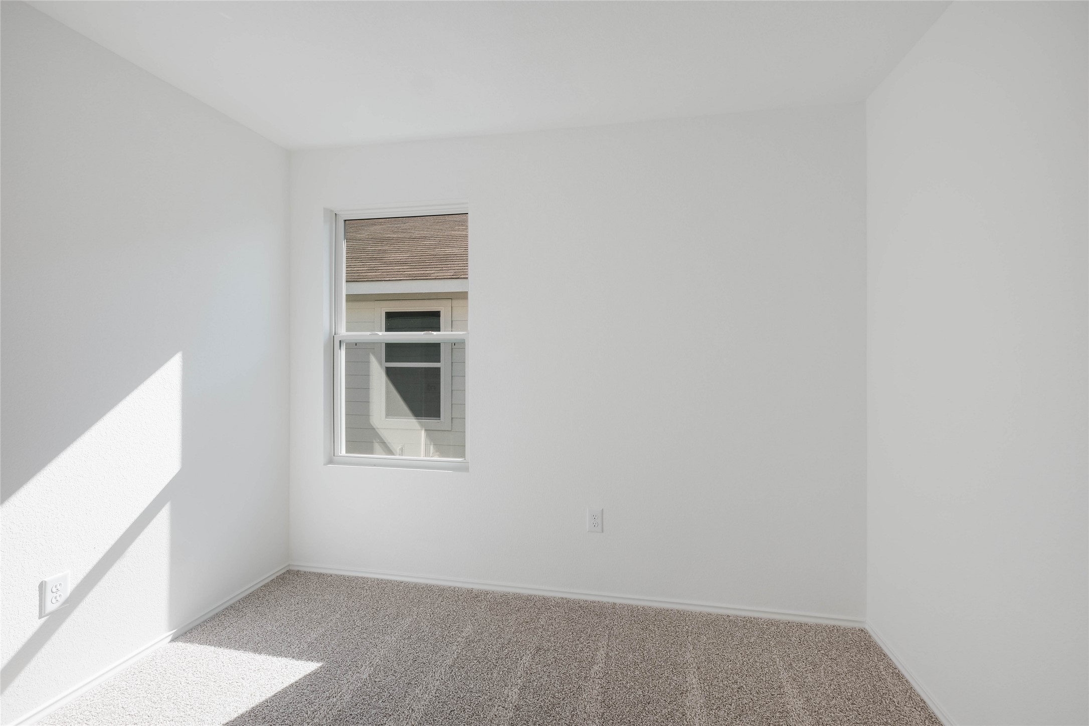 12204 Douglas Fir Circle Mustang Ridge, TX 78610 - Photo 14 of 17 a view of an empty room and window