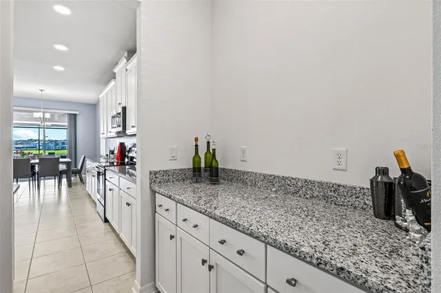 a living room with furniture and a ceiling fan