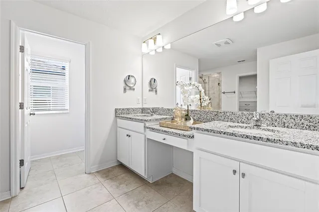 a view of a hallway with wooden floor and windows