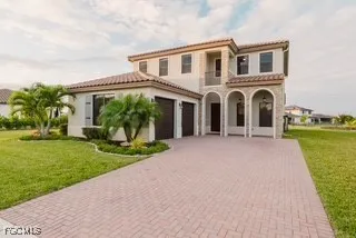 a front view of a house with a yard