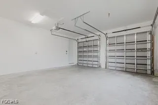 a view of an empty room with a garage