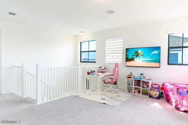 a room with furniture and a flat screen tv
