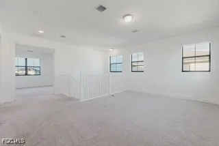 an empty room with windows and windows