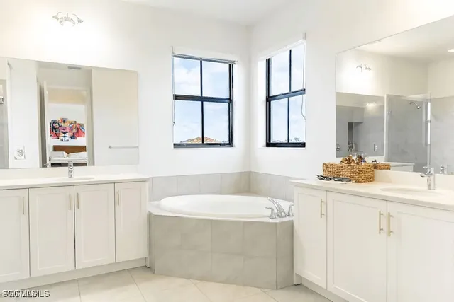 a bathroom with a bathtub and a sink