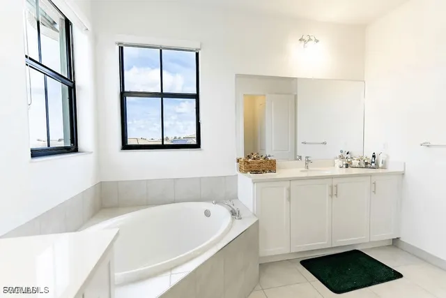 a bathroom with a bathtub and a sink