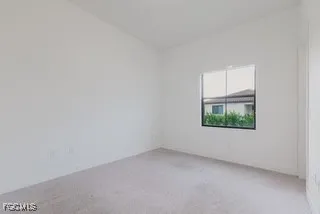 a view of an empty room with windows