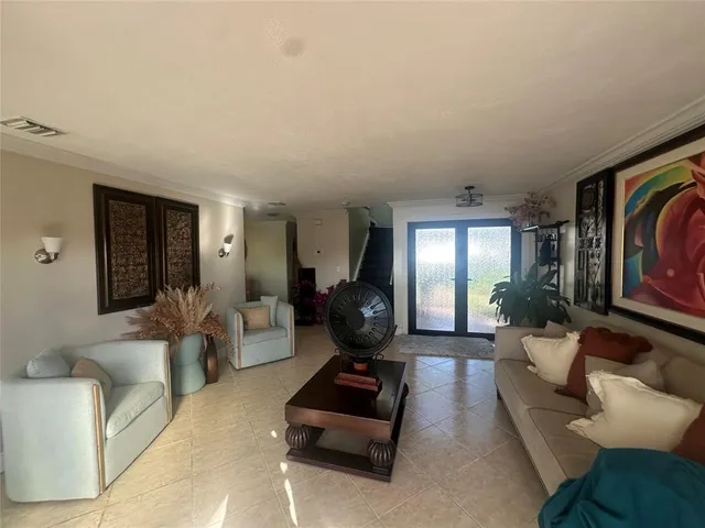 a living room with furniture and a window