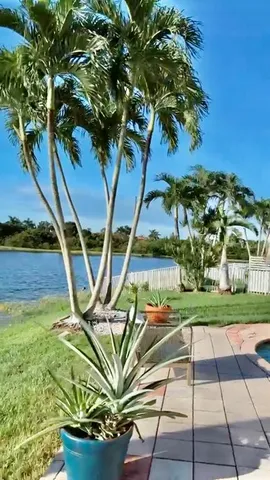 a backyard of a house with outdoor seating