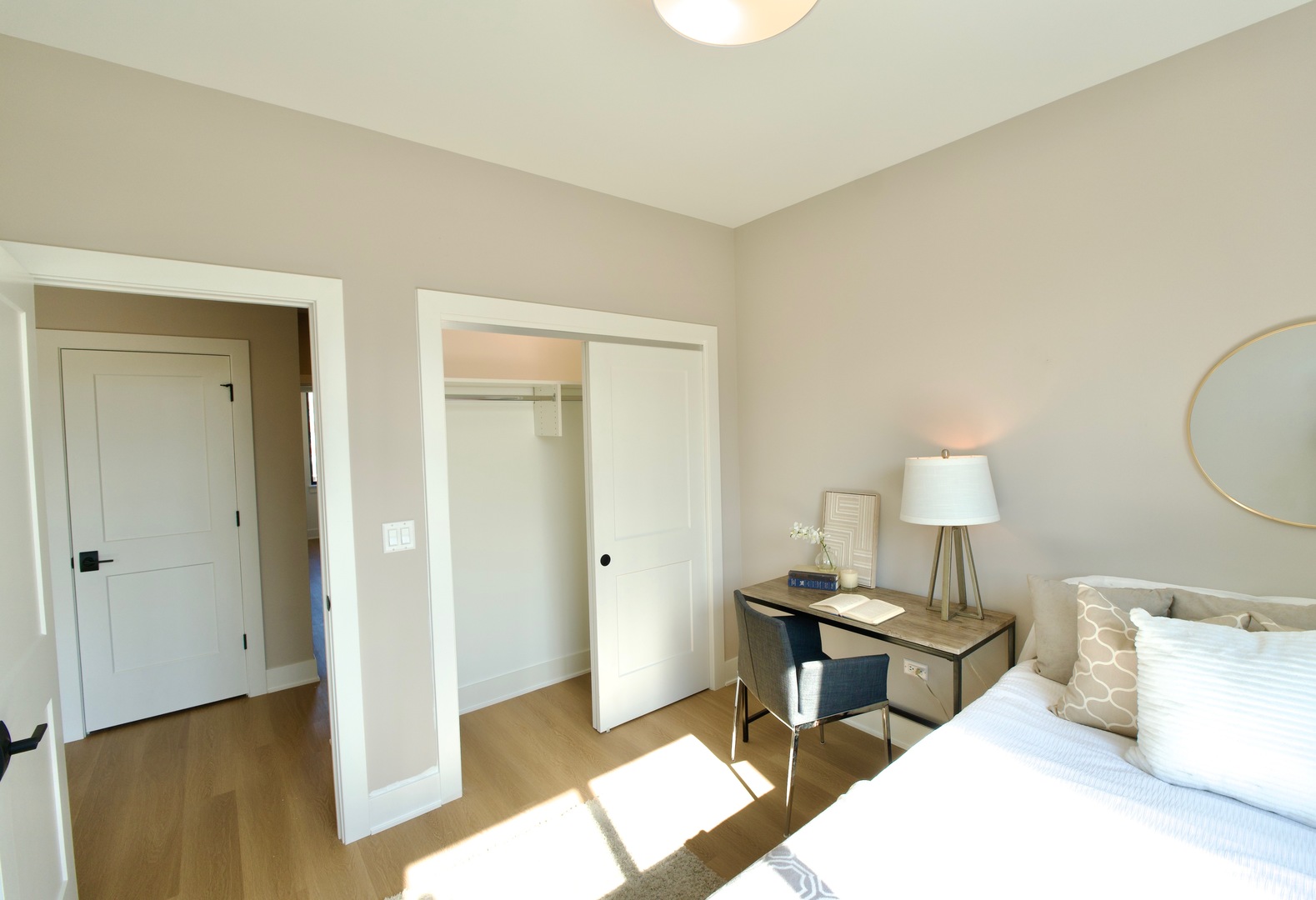 175 Pointe Drive, Unit 175 Northbrook, IL 60062 - Photo 18 of 23 a bedroom with a bed and a table in it