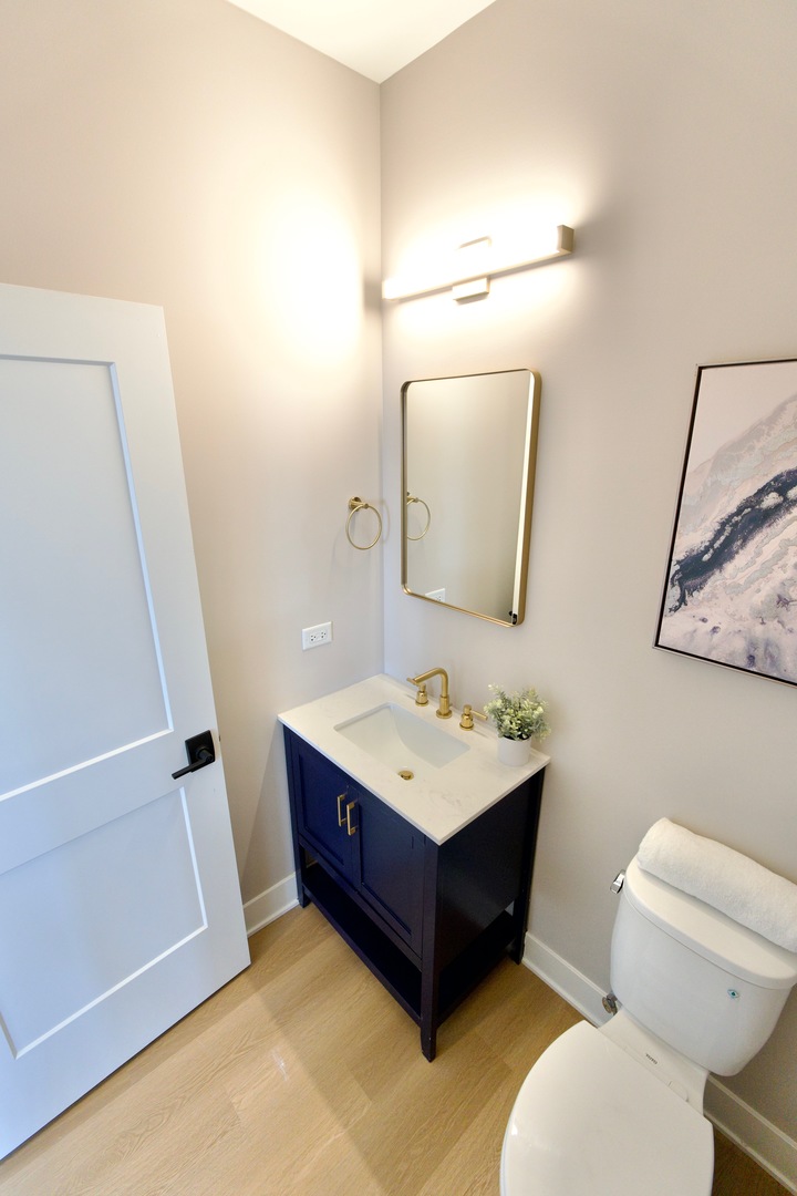 175 Pointe Drive, Unit 175 Northbrook, IL 60062 - Photo 23 of 23 a bathroom with a toilet a sink and a mirror