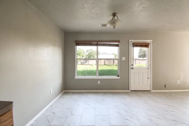 an empty room with windows