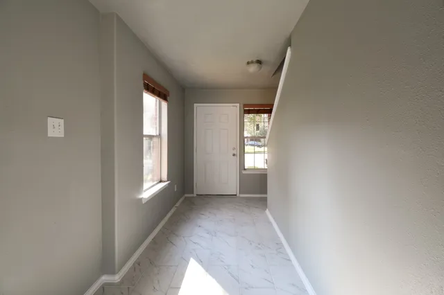 an empty room with windows