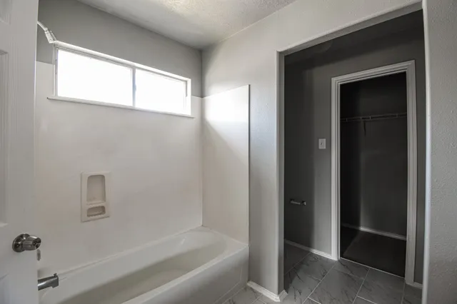 a bathroom with a bathtub