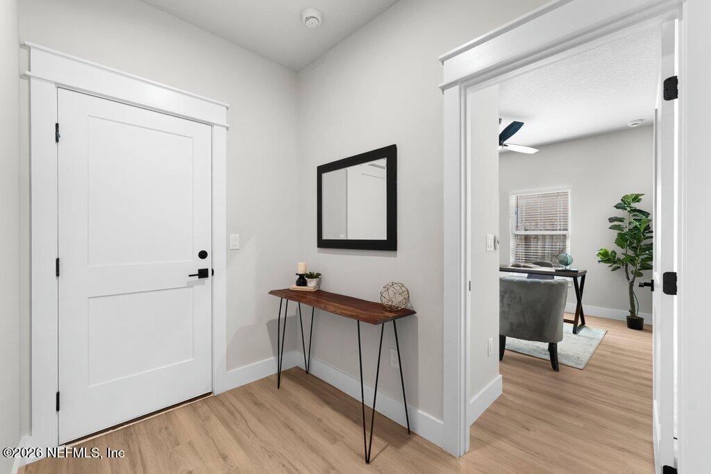 9019 Hipps Road Jacksonville, FL 32222 - Photo 27 of 35 a view of a hallway with seating area