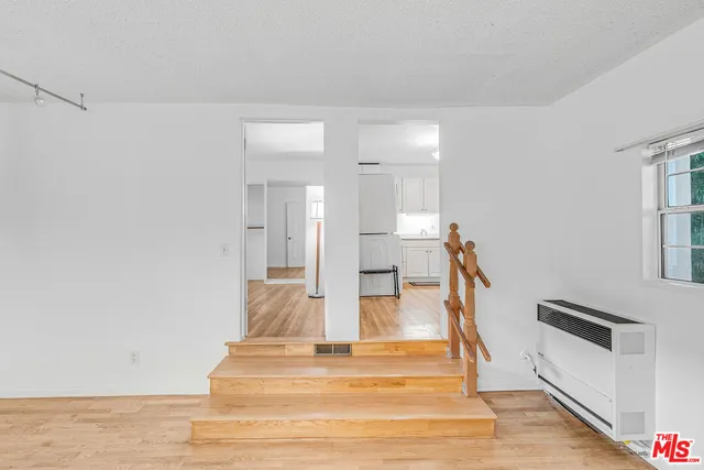 a view of kitchen with furniture and wooden floor