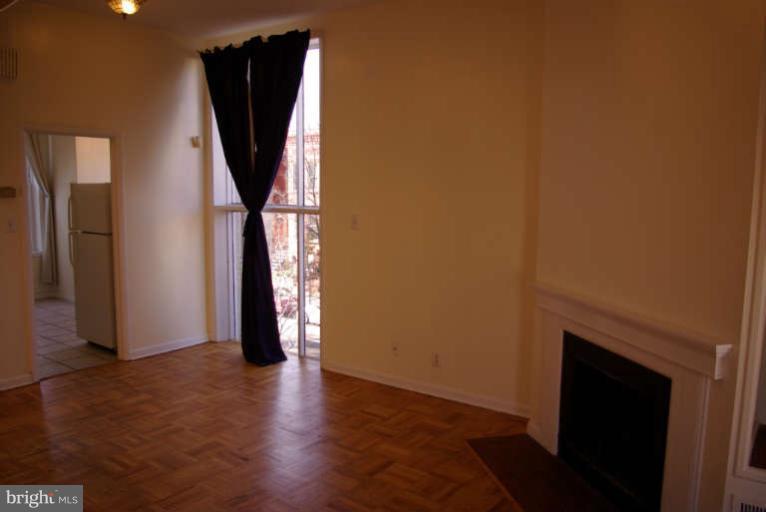 401 E Street Northeast Washington, DC 20002 - Photo 10 of 30 Upstairs unit living area windowwall, WBFP and HWF