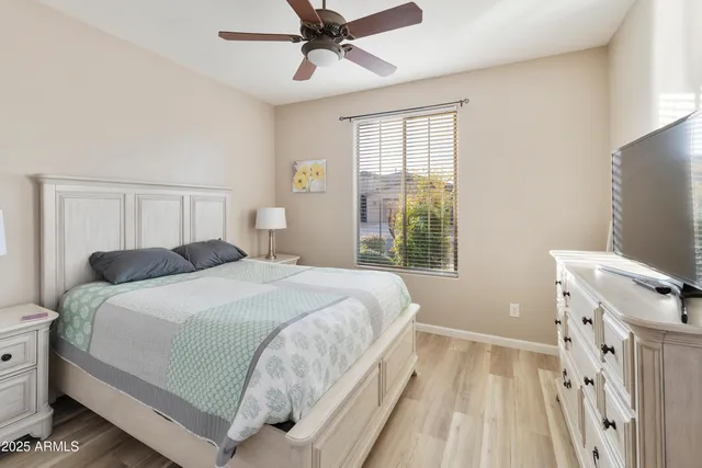 a bedroom with a bed and a window