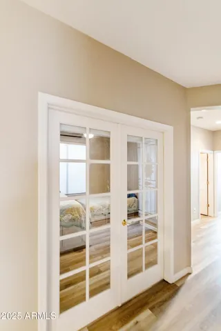 a view of wooden floor and windows in a room