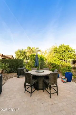 a view of a terrace with furniture and garden
