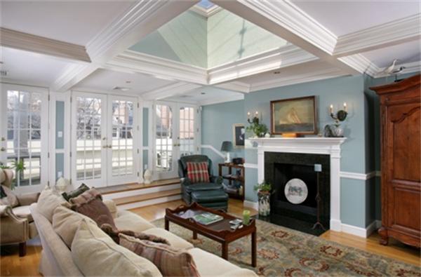 53 Beacon Street, Unit PH Boston, MA 02108 - Photo 6 of 10 a living room with furniture a flat screen tv and a fireplace