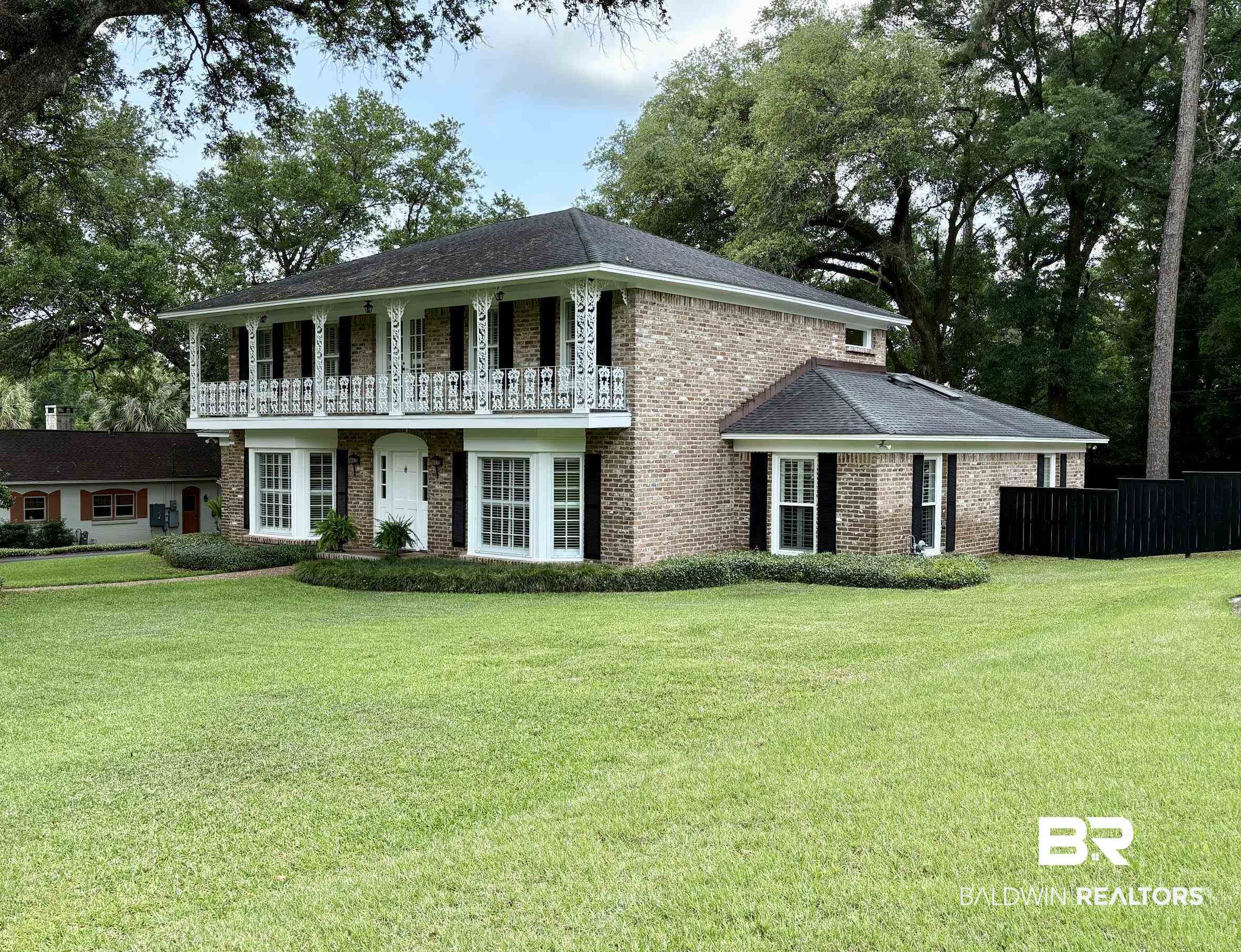 6105 Brandy Run Road South Mobile, AL 36608 - Photo 2 of 45 View of front facade with brick siding and a balcony