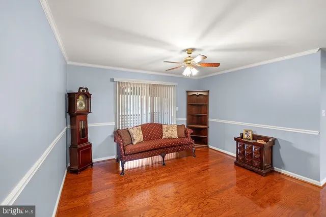 a living room with furniture a fireplace and a window