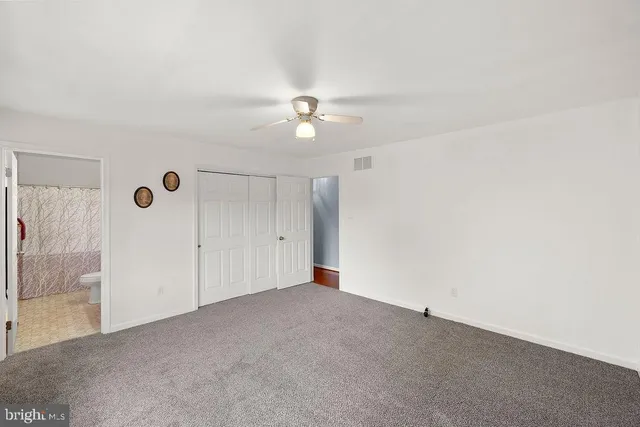 a bathroom with a sink and a mirror with toilet
