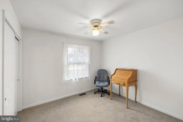 a bathroom with a sink toilet and mirror