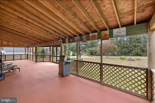 a view of an empty room with a balcony