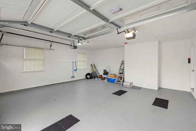 an aerial view of a house with a swimming pool