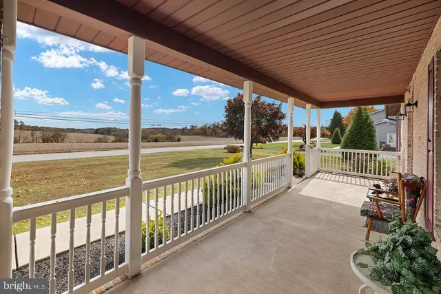 a brick building with a bench in front of it