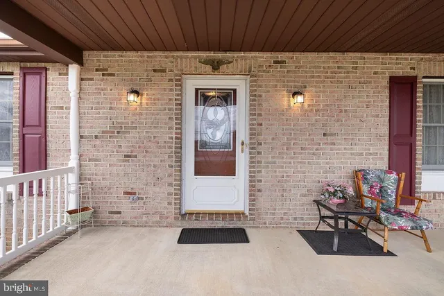 a view of a livingroom with a hardwood floor and a ceiling fan