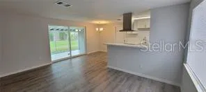 a view of a kitchen from the hallway