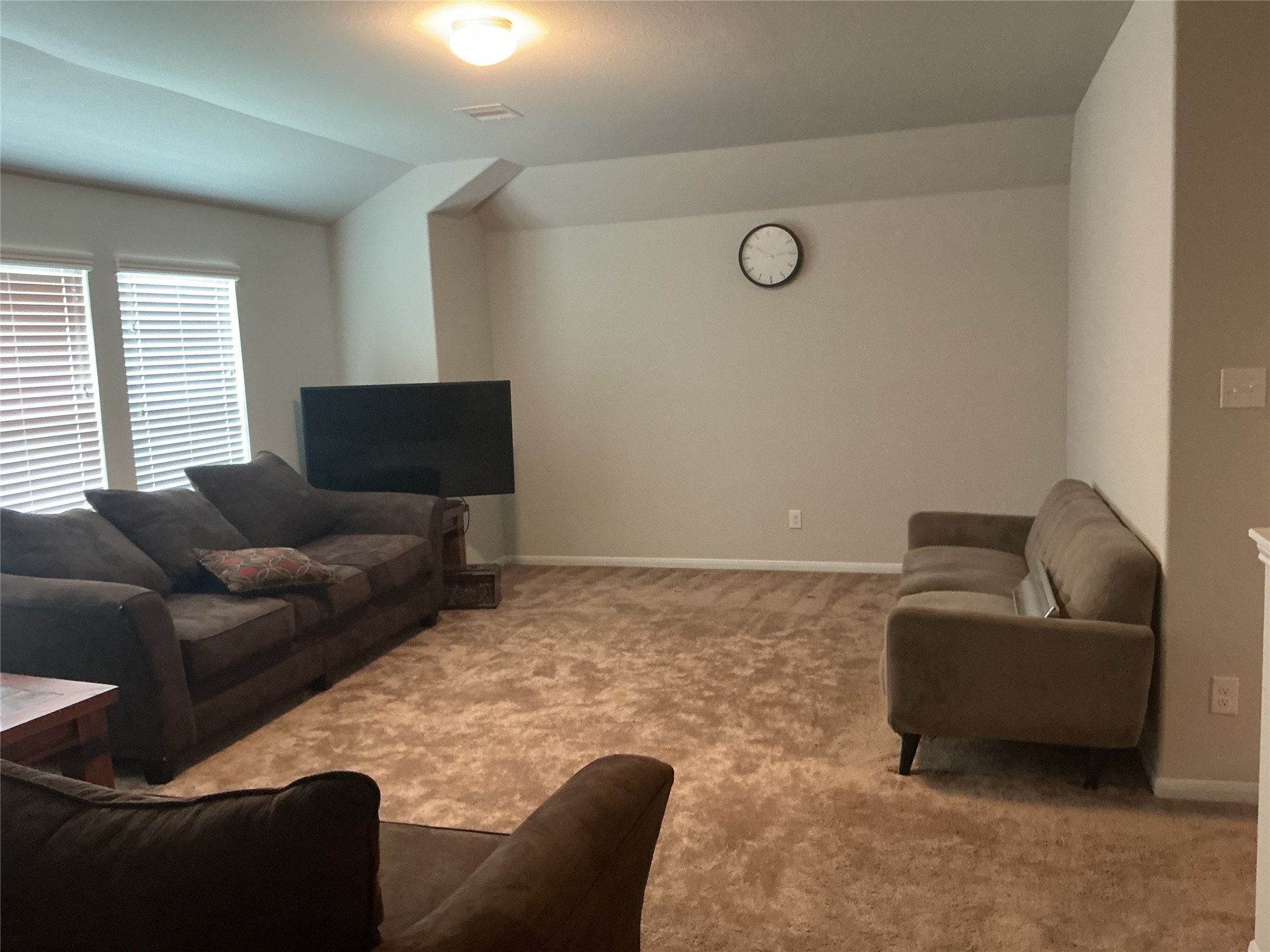 15318 Laceleaf Trail Houston, TX 77044 - Photo 9 of 12 a living room with furniture and a flat screen tv