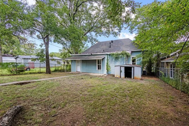 a house with trees in front of it