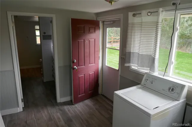 a room with a window and wooden floor