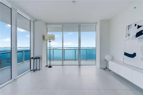 a view of an empty room and bathroom