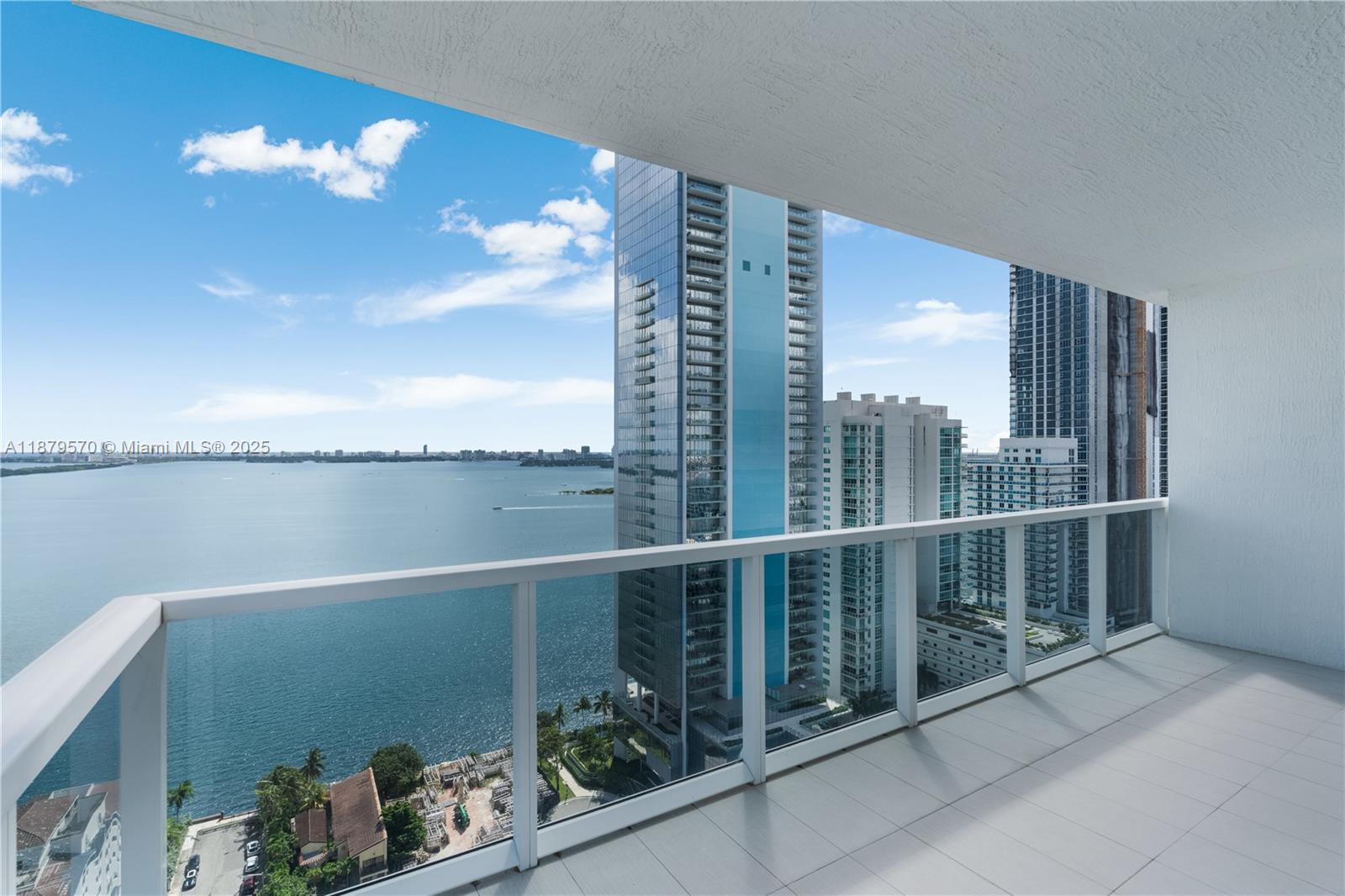 600 Northeast 27th Street, Unit 2801 Miami, FL 33137 - Photo 14 of 48 a view of a balcony with chair and potted plants