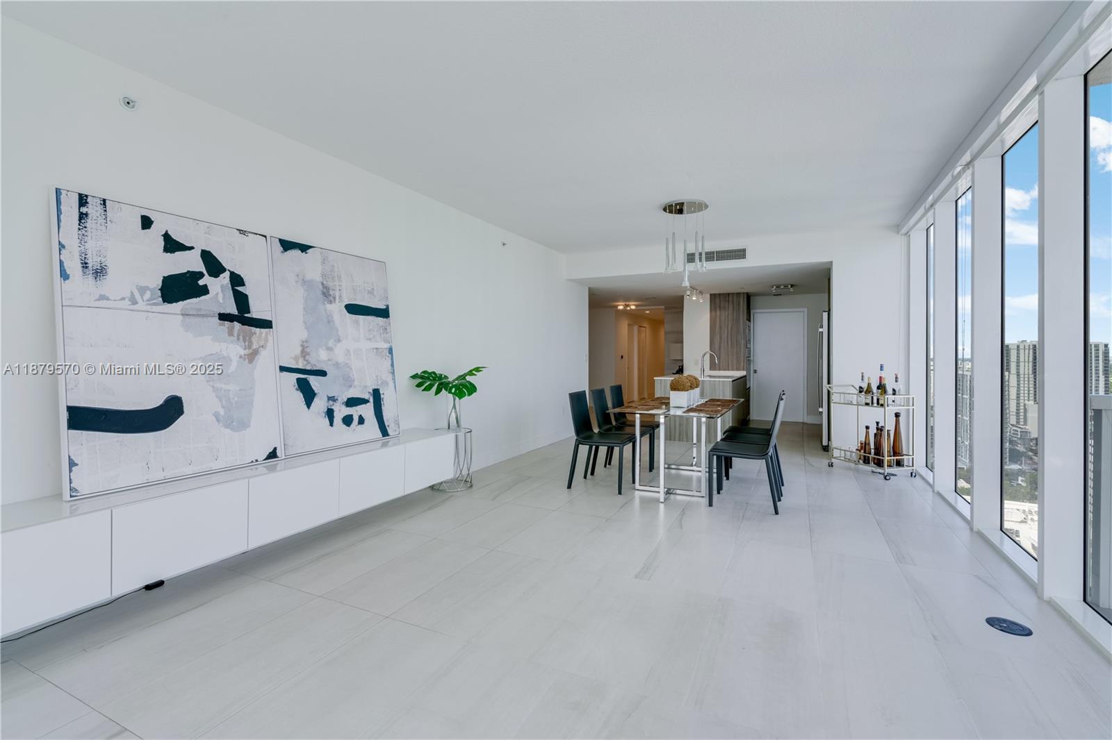600 Northeast 27th Street, Unit 2801 Miami, FL 33137 - Photo 19 of 48 a view of a dining room with furniture and a large window