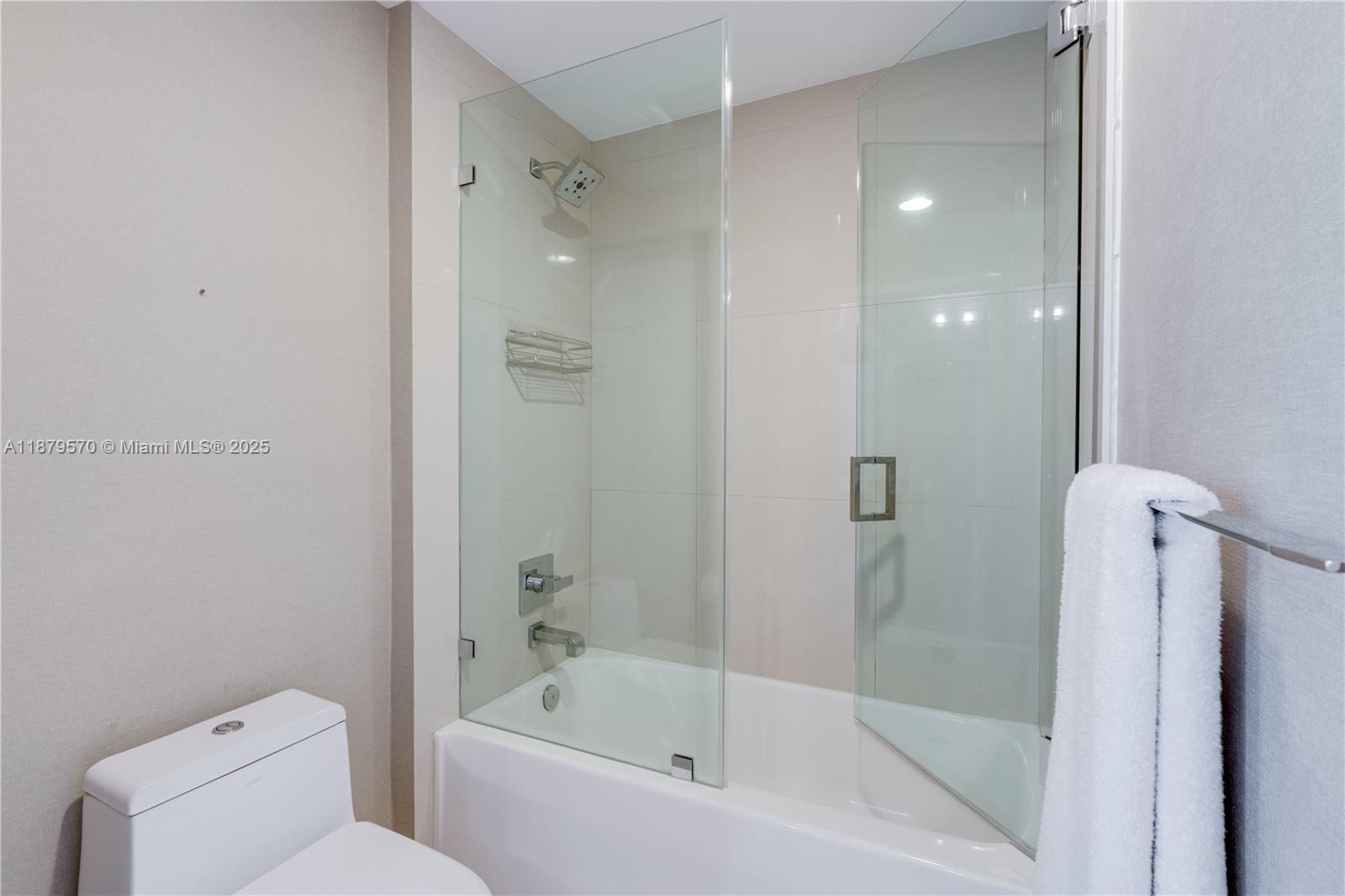 600 Northeast 27th Street, Unit 2801 Miami, FL 33137 - Photo 23 of 48 a bathroom with a bathtub and a shower