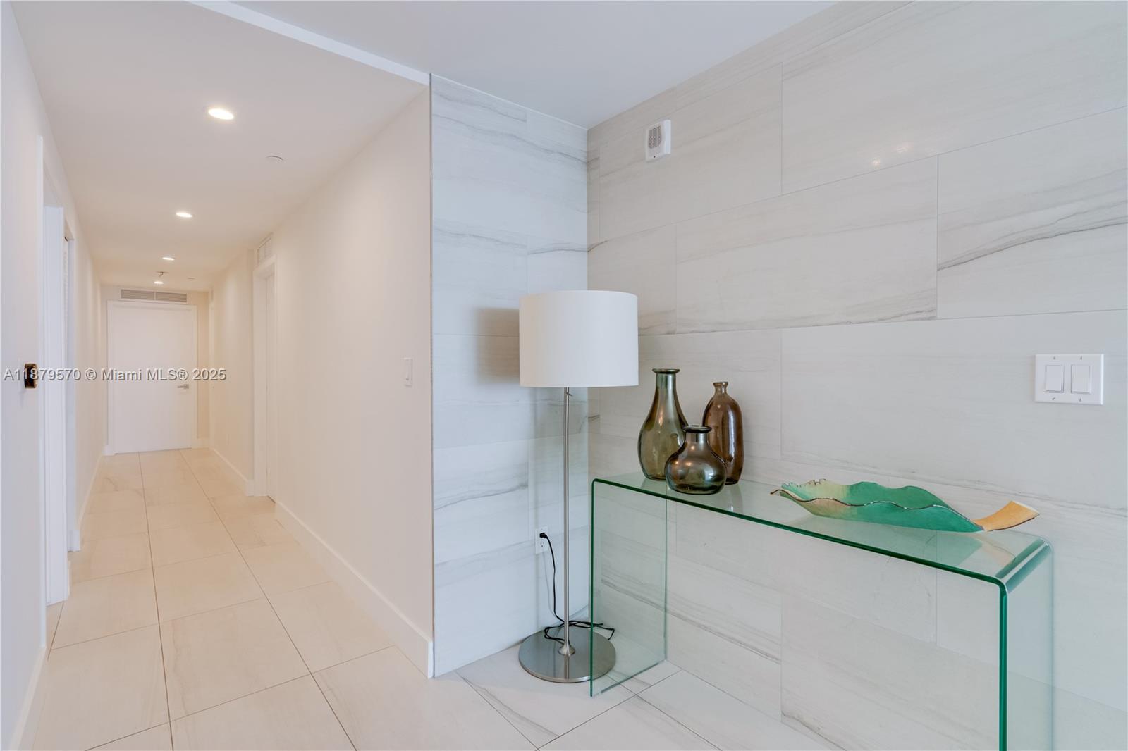 600 Northeast 27th Street, Unit 2801 Miami, FL 33137 - Photo 27 of 48 a kitchen with a sink and a stove top oven
