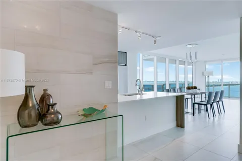 a kitchen with a table and chairs