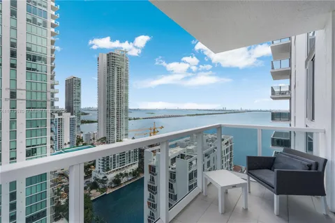 a view of a balcony with chairs